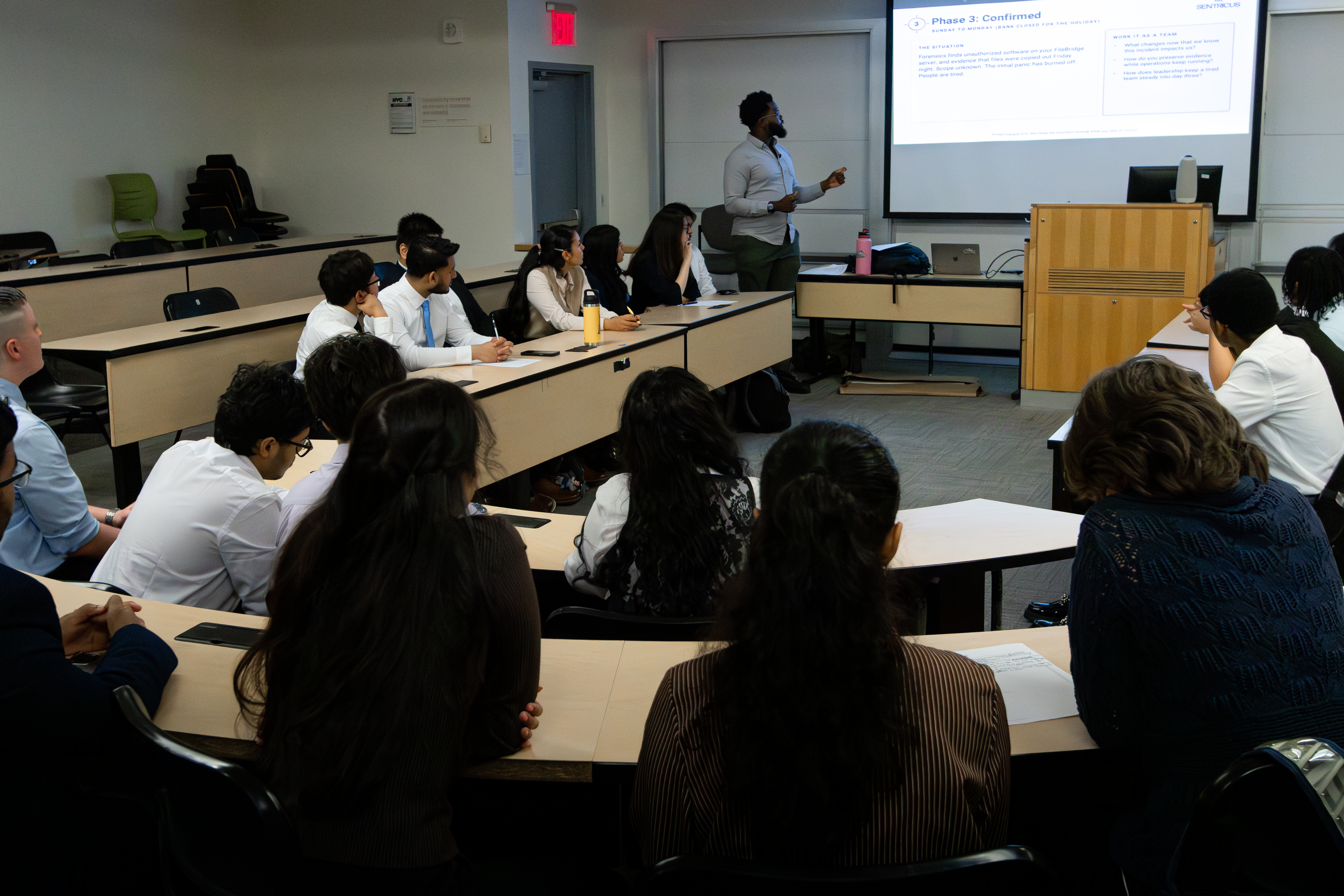 Otuoze Baiye facilitating the OPERATION DANGER CLOSE tabletop exercise for Baruch College students
